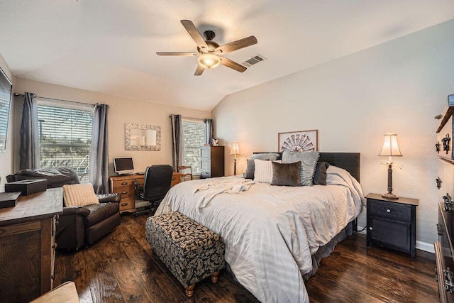 bedroom featuring lofted ceiling, multiple windows, visible vents, and dark wood finished floors