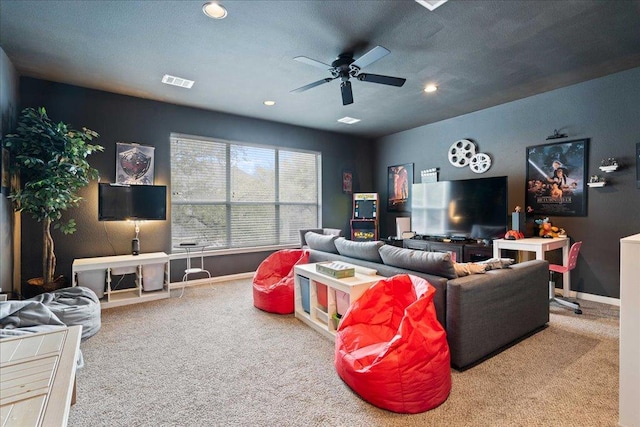 living area with carpet, recessed lighting, visible vents, a ceiling fan, and baseboards