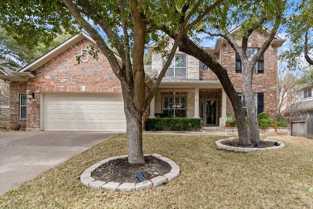 view of front facade featuring a garage, driveway, a front lawn, and brick siding