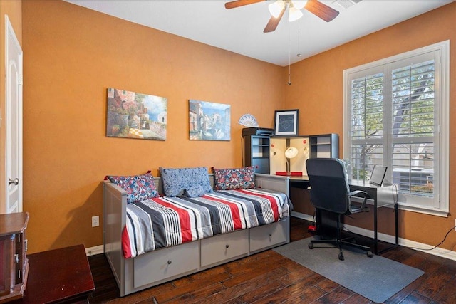 bedroom with ceiling fan, wood-type flooring, and baseboards