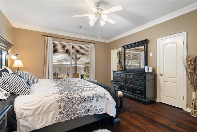 bedroom featuring ornamental molding, dark wood-style flooring, visible vents, and ceiling fan