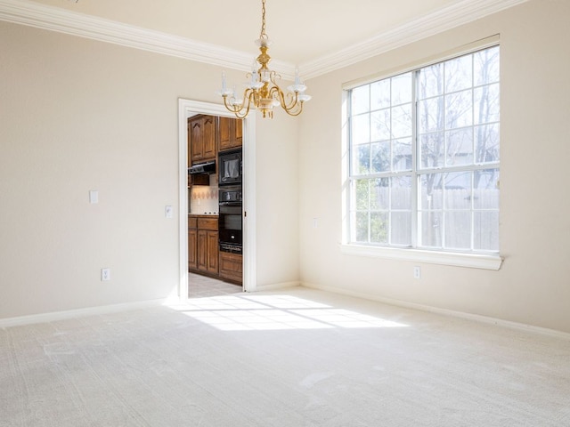 unfurnished dining area with baseboards, ornamental molding, an inviting chandelier, and light colored carpet