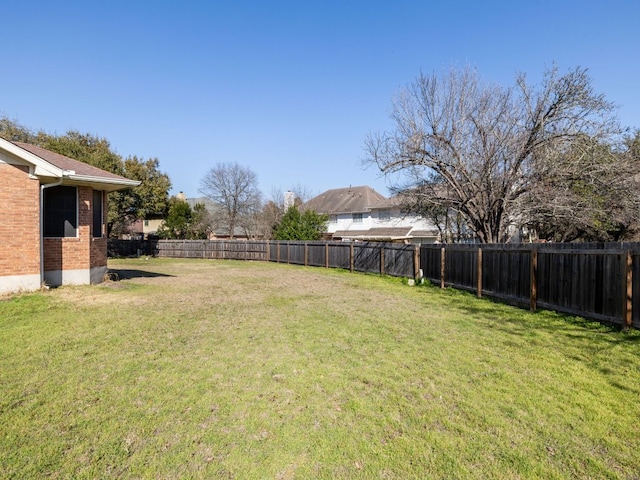 view of yard featuring a fenced backyard