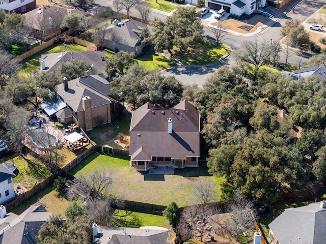 birds eye view of property with a residential view