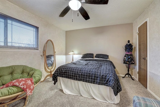 bedroom featuring carpet, ceiling fan, a textured ceiling, and baseboards