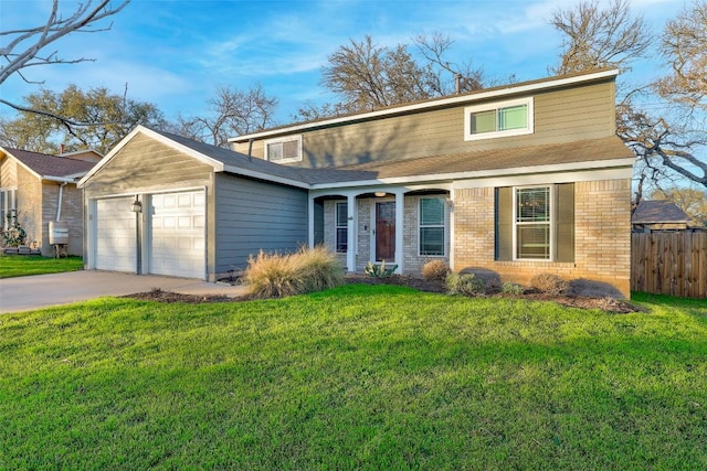 traditional-style home featuring concrete driveway, an attached garage, fence, a front lawn, and brick siding