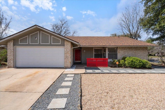 view of front facade with roof with shingles, a porch, an attached garage, stone siding, and driveway