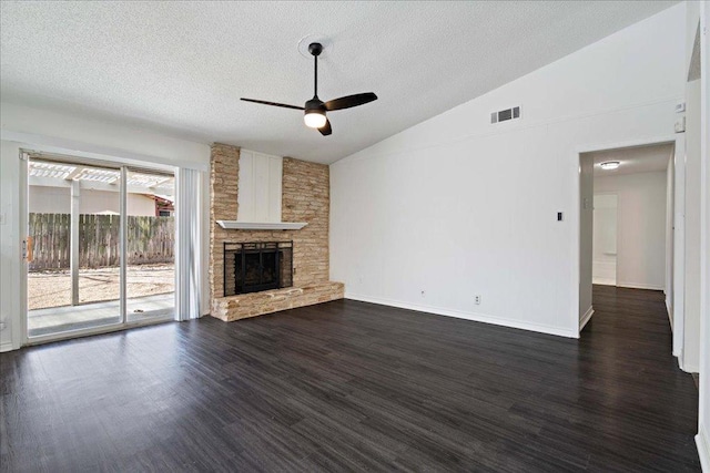 12306 Hickorystick Cv, Austin, TX 78750 - unfurnished living room featuring ceiling fan, a textured ceiling, visible vents, vaulted ceiling, and dark wood finished floors