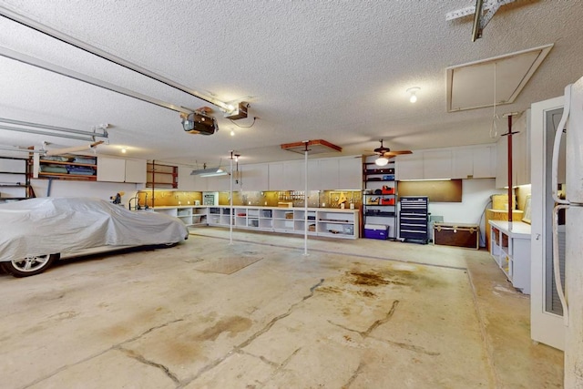1905 Brushy Bend Dr, Round Rock, TX 78681 - garage with a garage door opener and a ceiling fan