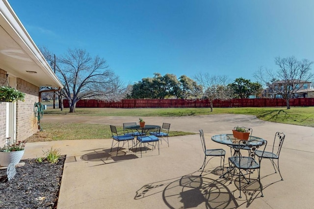 view of patio / terrace featuring outdoor dining space and fence