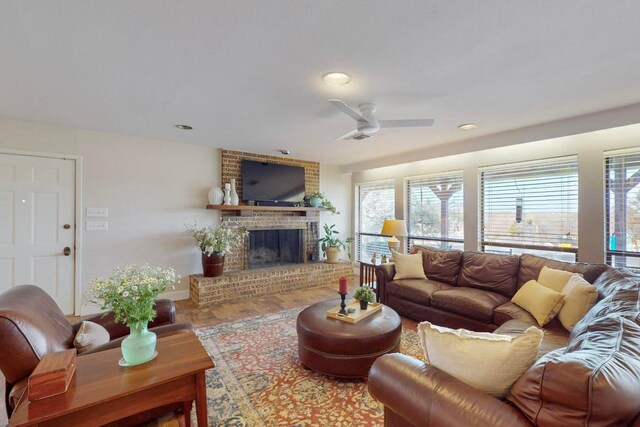 1905 Brushy Bend Dr, Round Rock, TX 78681 - living area featuring a brick fireplace, a ceiling fan, wood finished floors, recessed lighting, and baseboards