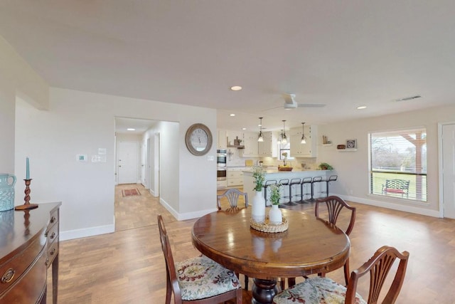 dining space with recessed lighting, light wood-style flooring, visible vents, and baseboards