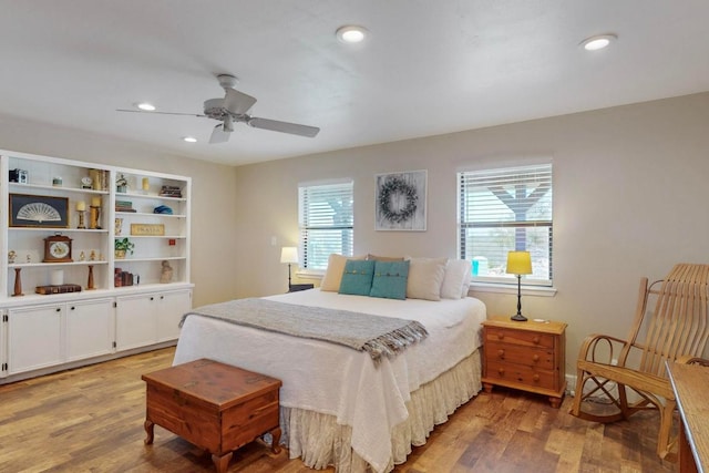 bedroom featuring a ceiling fan, light wood-style flooring, and recessed lighting