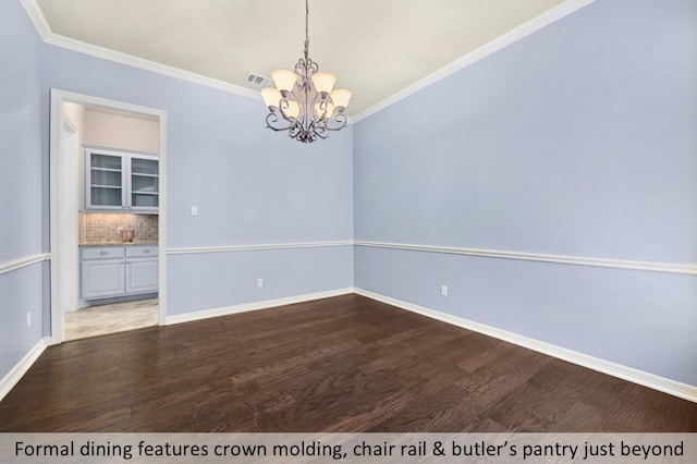 unfurnished dining area with ornamental molding, dark wood-style flooring, visible vents, and baseboards