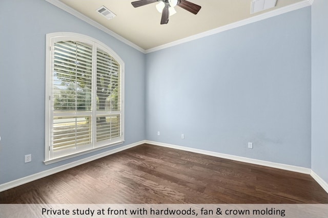 empty room with ornamental molding, visible vents, dark wood finished floors, and baseboards