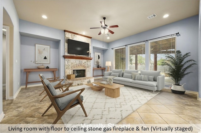 tiled living room with baseboards, visible vents, a ceiling fan, a fireplace, and recessed lighting