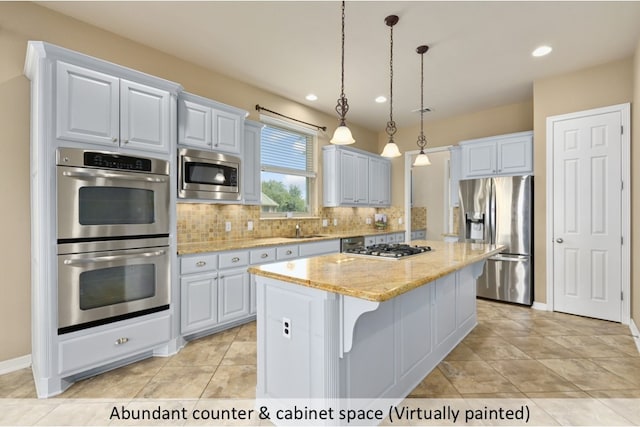 kitchen with decorative backsplash, appliances with stainless steel finishes, a center island, hanging light fixtures, and a sink