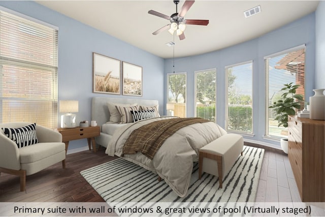 bedroom with wood-type flooring, visible vents, and ceiling fan