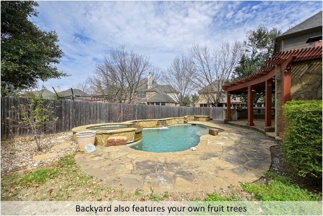 view of pool featuring a fenced backyard, a pergola, a pool with connected hot tub, and a patio area
