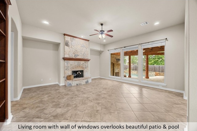 unfurnished living room featuring recessed lighting, a fireplace, baseboards, visible vents, and a ceiling fan