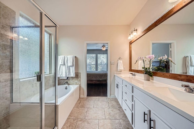 165 Crescent Heights Dr, Georgetown, TX 78628 - ensuite bathroom with double vanity, a shower stall, a garden tub, and a ceiling fan