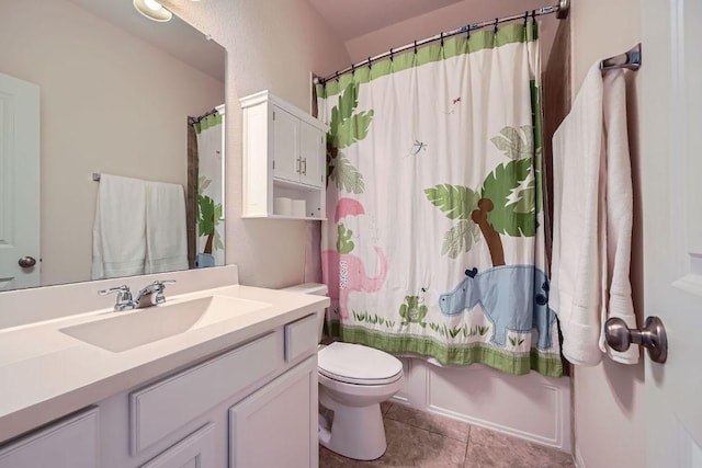 bathroom with tile patterned floors, vanity, toilet, and shower / tub combo