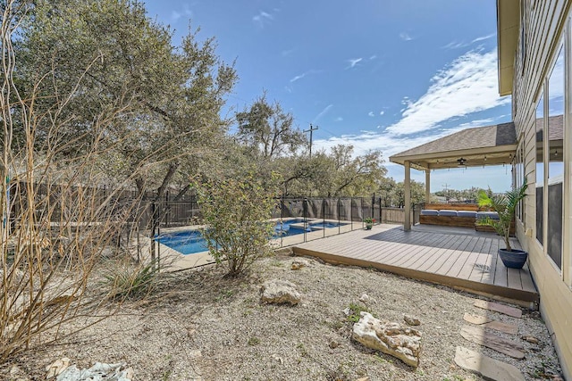 view of pool featuring a fenced backyard, a fenced in pool, and a deck