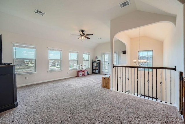 165 Crescent Heights Dr, Georgetown, TX 78628 - carpeted spare room with a chandelier, vaulted ceiling, a ceiling fan, arched walkways, and baseboards