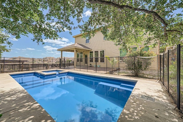 165 Crescent Heights Dr, Georgetown, TX 78628 - view of swimming pool featuring a pool with connected hot tub, a fenced backyard, and a patio