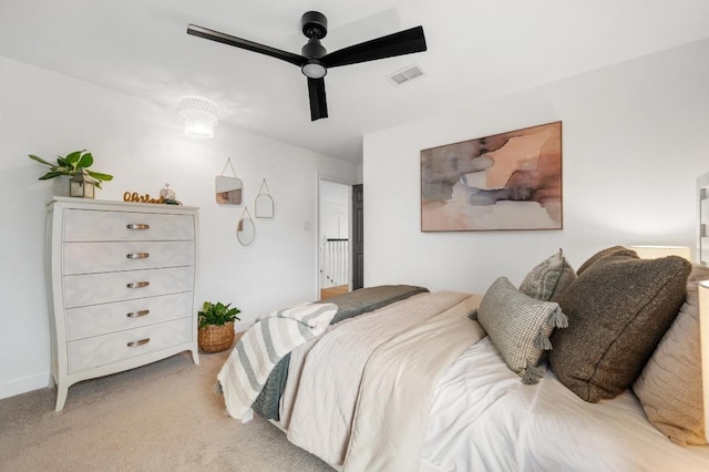 bedroom featuring light carpet, visible vents, and ceiling fan