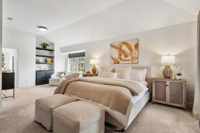 bedroom with carpet flooring, baseboards, visible vents, and vaulted ceiling