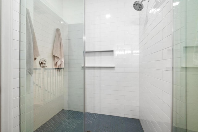 bathroom with a shower stall