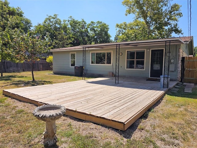 deck featuring a yard, central AC, and fence