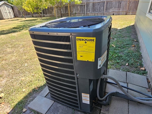 exterior details with fence and central air condition unit