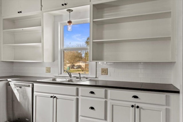 kitchen with dark countertops, a sink, open shelves, and stainless steel dishwasher