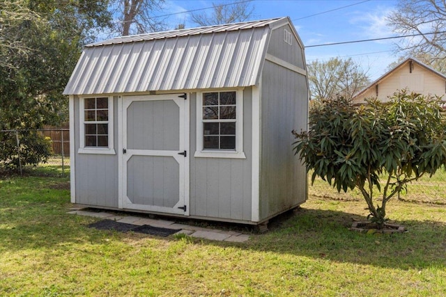 view of shed featuring fence