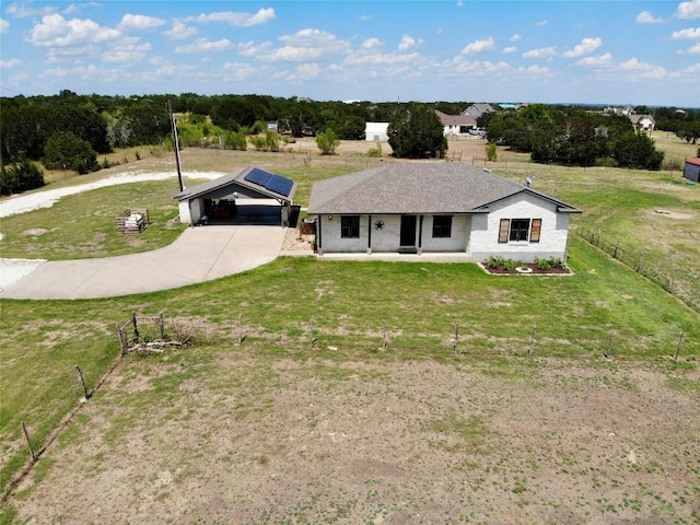 single story home featuring driveway, a front lawn, and fence