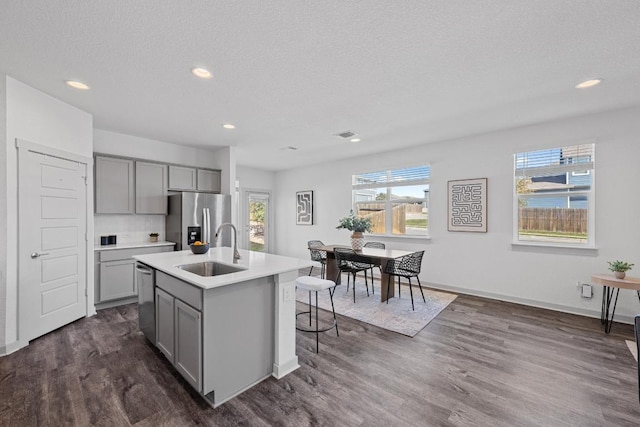 10410 Fulton Ave, Austin, TX 78754 - kitchen featuring gray cabinetry, a sink, stainless steel appliances, healthy amount of natural light, and recessed lighting