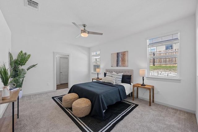 10410 Fulton Ave, Austin, TX 78754 - bedroom with carpet floors, ceiling fan, and baseboards