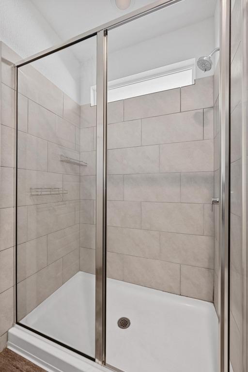 10410 Fulton Ave, Austin, TX 78754 - bathroom with a shower stall