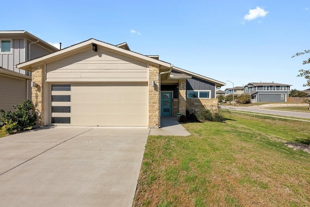 view of front facade with board and batten siding, a front yard, a garage, stone siding, and driveway