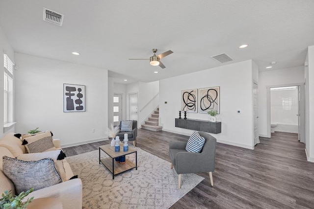 10410 Fulton Ave, Austin, TX 78754 - living room featuring wood finished floors, recessed lighting, stairs, baseboards, and healthy amount of natural light