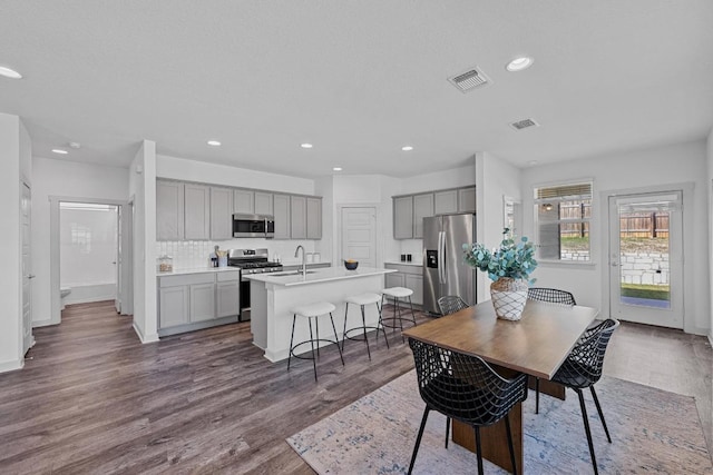 10410 Fulton Ave, Austin, TX 78754 - dining area featuring recessed lighting, dark wood-style flooring, and baseboards