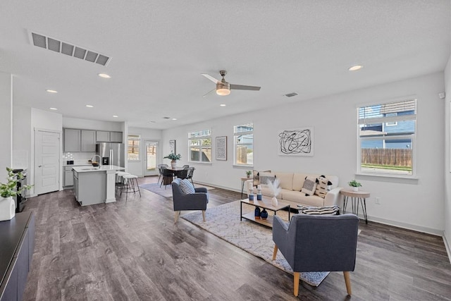 10410 Fulton Ave, Austin, TX 78754 - living room with plenty of natural light, dark wood-style flooring, baseboards, ceiling fan, and recessed lighting
