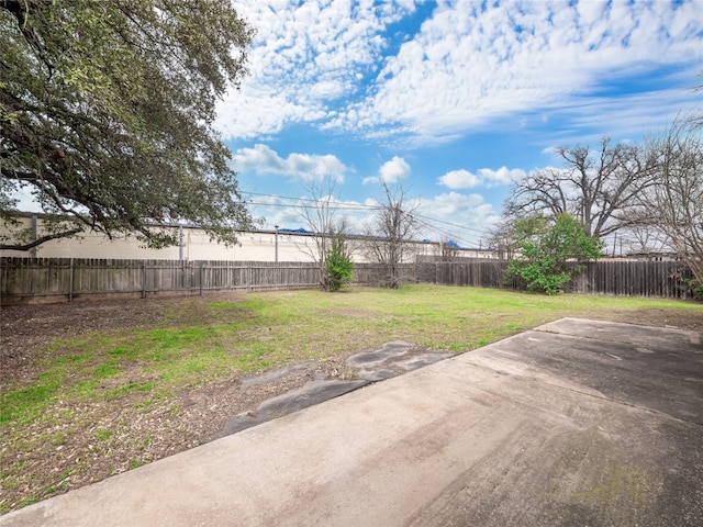 view of yard with a patio area and a fenced backyard