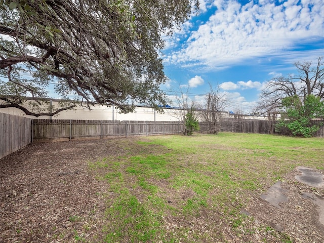 view of yard with a fenced backyard