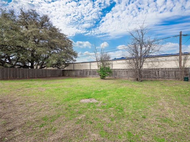 view of yard featuring a fenced backyard