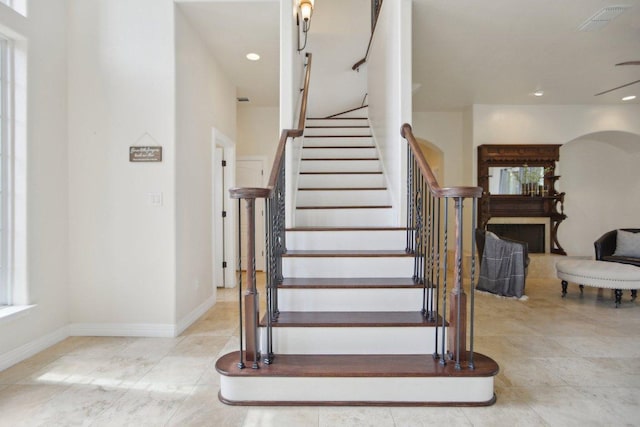 staircase featuring recessed lighting, visible vents, and baseboards