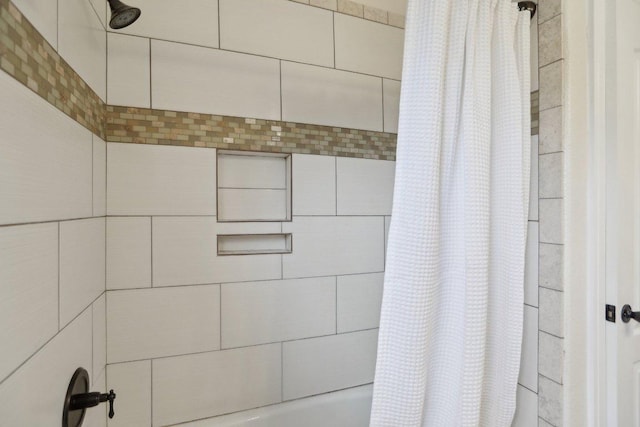 bathroom with shower / tub combo with curtain