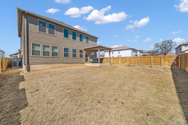 back of property featuring a patio area and a fenced backyard